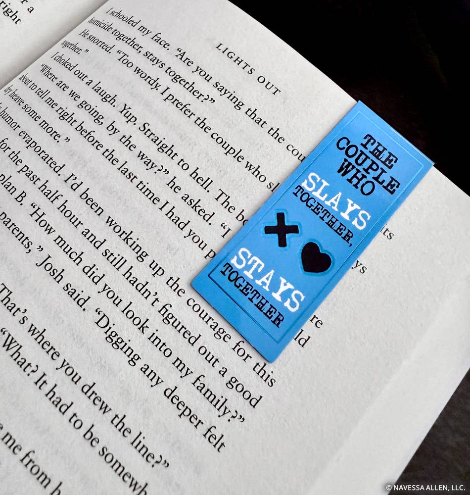 Blue bookmark with text and symbols on a book page
