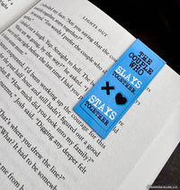 Blue bookmark with text and symbols on a book page