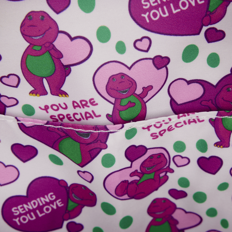 Barney-themed fabric with hearts, polka dots, and text on a white background