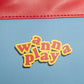 patch with 'wanna play' text on a blue background with red border