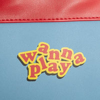 patch with 'wanna play' text on a blue background with red border