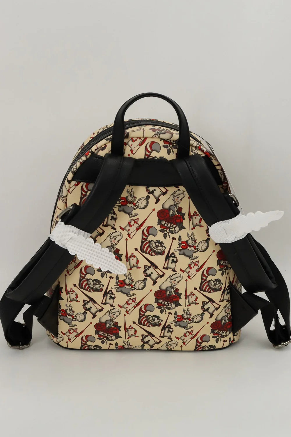The Alice In Wonderland Loungefly Collection Is Mad With Style - bags 