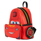A red Lightning McQueen themed backpack with a front zippered pocket shaped like his face, a black top handle, and a circular tire detail on the side featuring 'Lightyear' branding.