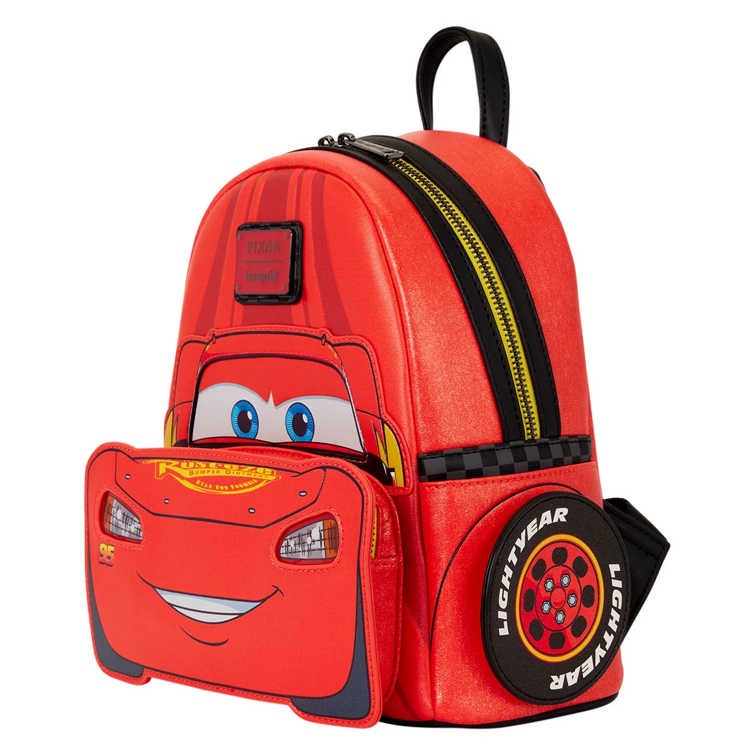 A red Lightning McQueen themed backpack with a front zippered pocket shaped like his face, a black top handle, and a circular tire detail on the side featuring 'Lightyear' branding.