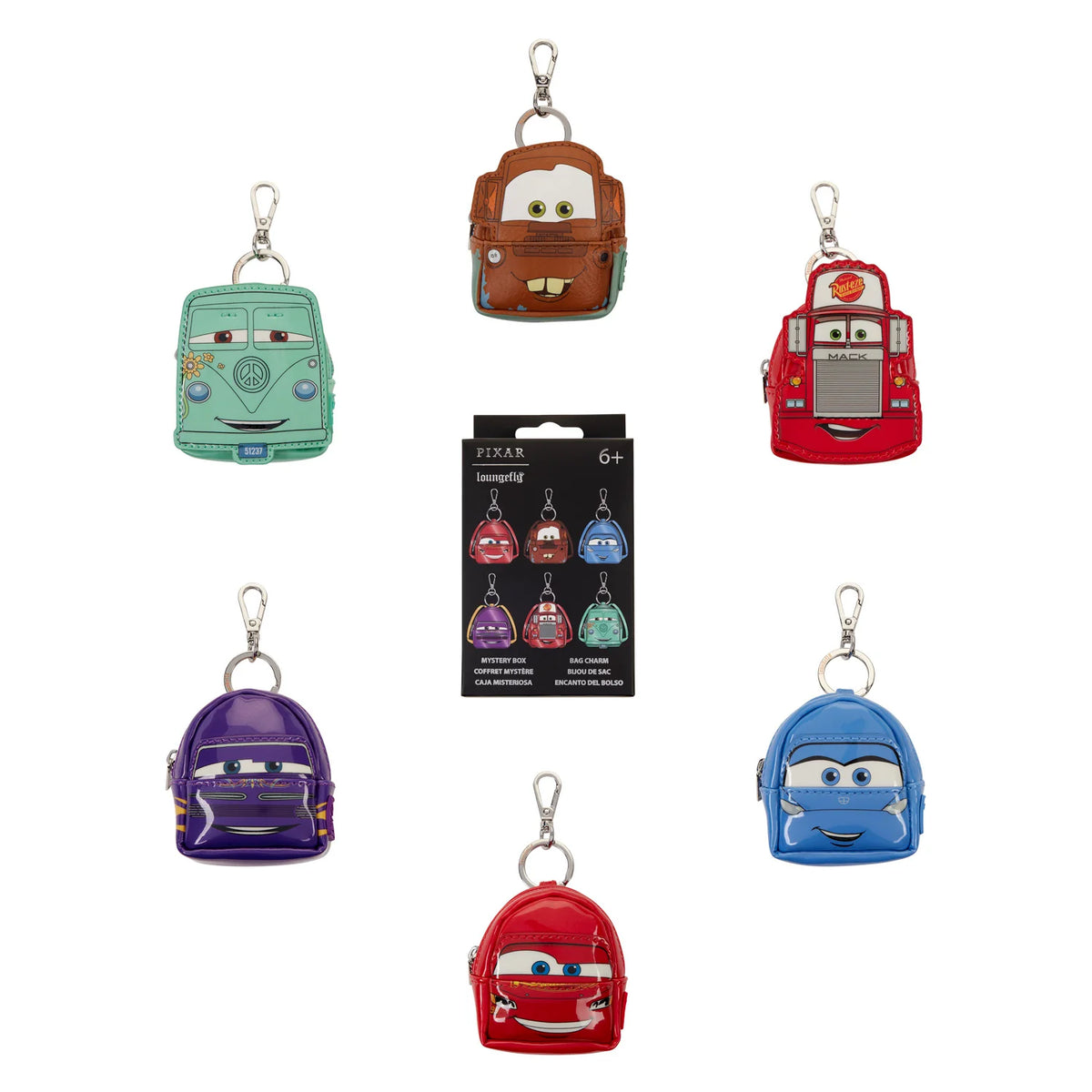 Six small character backpack keychains arranged around a black retail package on a white background. The characters resemble Disney Pixar's Cars, including a mint green van, brown truck, red fire truck, purple car, blue car, and red car, each with a silver key ring and clasp.