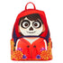 A red and orange Day of the Dead themed backpack featuring a large sugar skull graphic on the front, floral patterns on the sides, and a top carrying handle, shown against a plain white background.