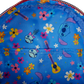 Colorful fabric with cartoon characters and flowers on a blue background