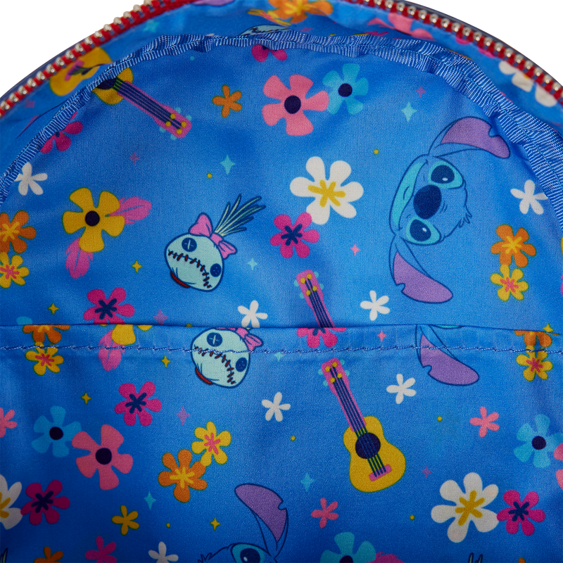 Colorful fabric with cartoon characters and flowers on a blue background