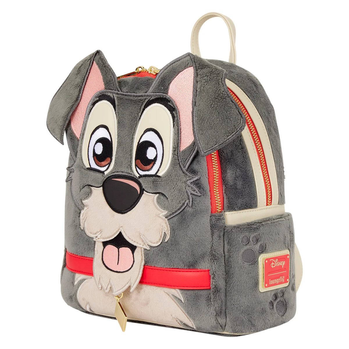 A plush Disney dog backpack featuring a gray and cream dog face design with pink inner ears, red zipper accents, and a small Disney Artisan label on the side pocket, shown on a plain white background.