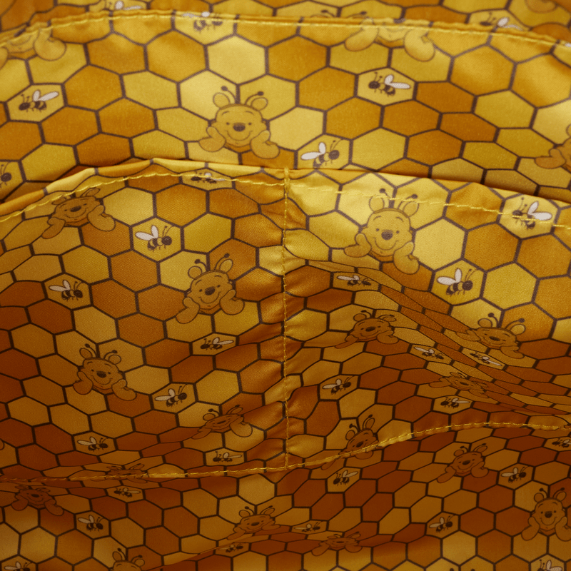 Fabric with honeycomb and bear pattern, resembling a beekeeper's outfit.
