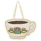 Decorative sign shaped like a coffee cup with 'Central Perk' logo on a white background