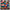 Multicolored patterned fabric with various shapes and characters on a black background