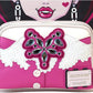 Pink handbag with decorative bow and lace details, featuring a visible brand logo, against a colorful background.