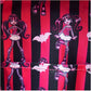 Fabric with cartoon character design on red and black striped background