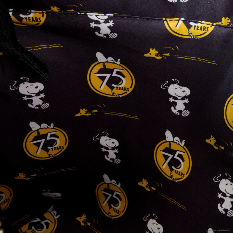 A Loungefly tote bag celebrating the 75th anniversary of Peanuts, with playful illustrations of Snoopy and the gang. Comes with a coordinating Snoopy coin bag.