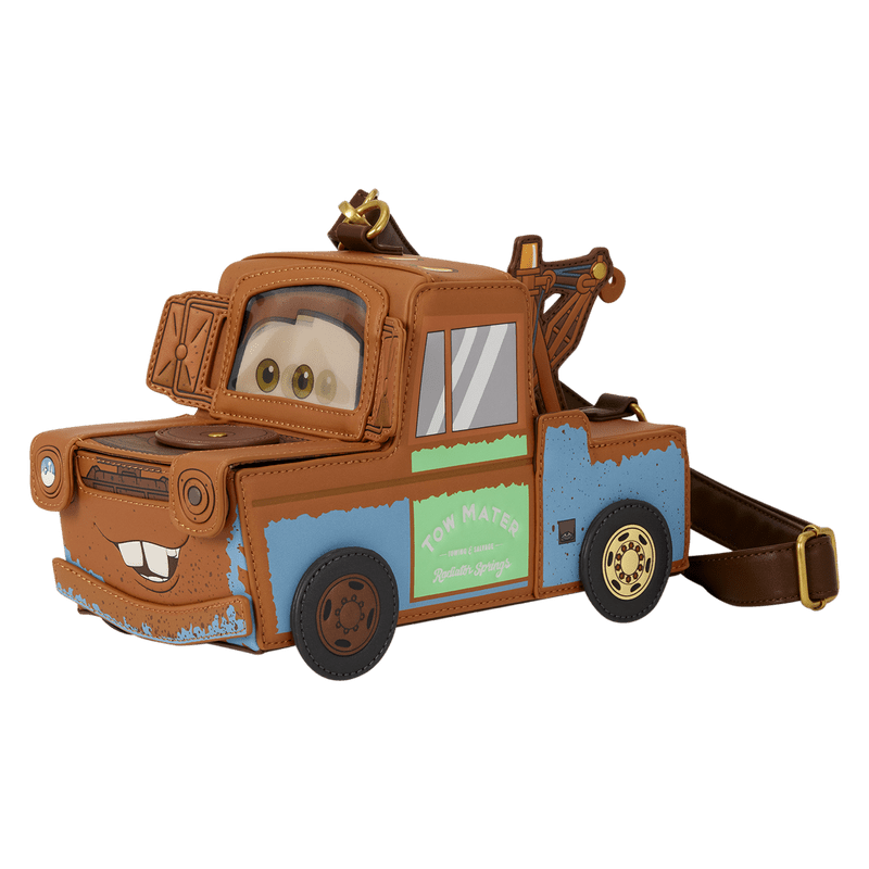 A character-shaped crossbody bag designed like the tow truck Mater from Disney's Cars, featuring a brown body with blue and green paint details, a front windshield with cartoon eyes, and a brown shoulder strap on a plain white background.