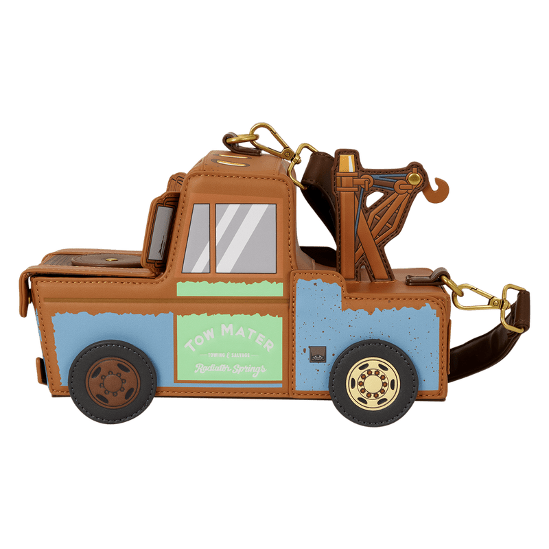 A tow truck-shaped keychain or bag charm with a brown faux-leather body, light blue side panels, a mint green side panel, and a gold-tone tow arm and hardware, shown on a plain white background.