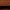 Close-up of a fabric surface with a repeating orange tow truck pattern and the words 'TOW MATE' on a dark brown background, with a stitched edge visible and a dark interior opening below.