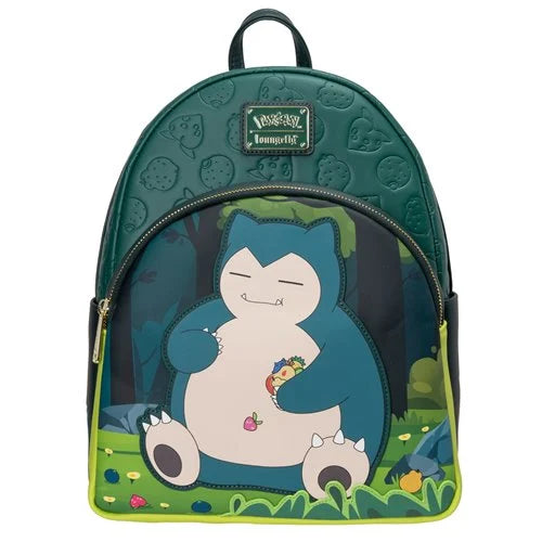 A Loungefly Pokémon Snorlax backpack in dark teal green, featuring a large graphic of Snorlax sitting in a grassy forest on the front pocket, with a small Pokémon logo patch on the upper front.
