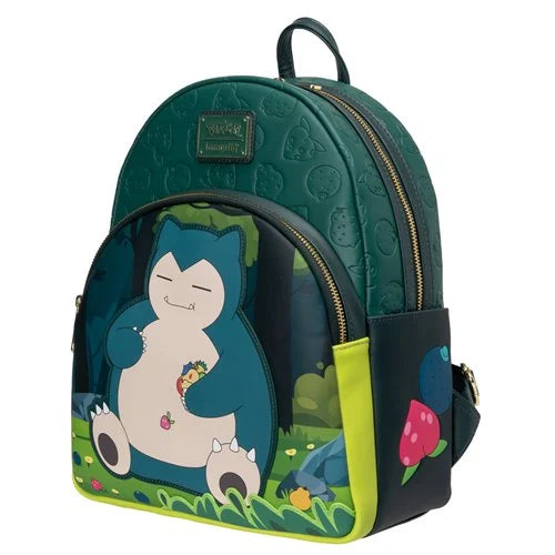 A Loungefly Capsule x Pokemon Snorlax backpack in dark green, featuring a large graphic of Snorlax on the front pocket, a small grey Pokemon on its belly, and a pink berry on the side pocket.