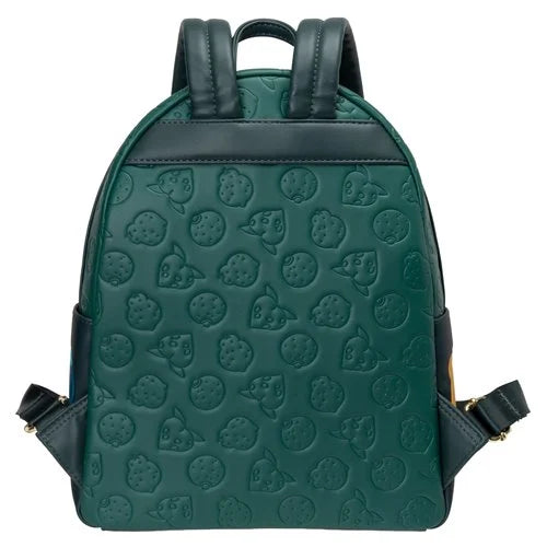 A dark green backpack featuring an embossed pattern of fruits, with dark green faux-leather trim, top handles, and side straps on a white background.