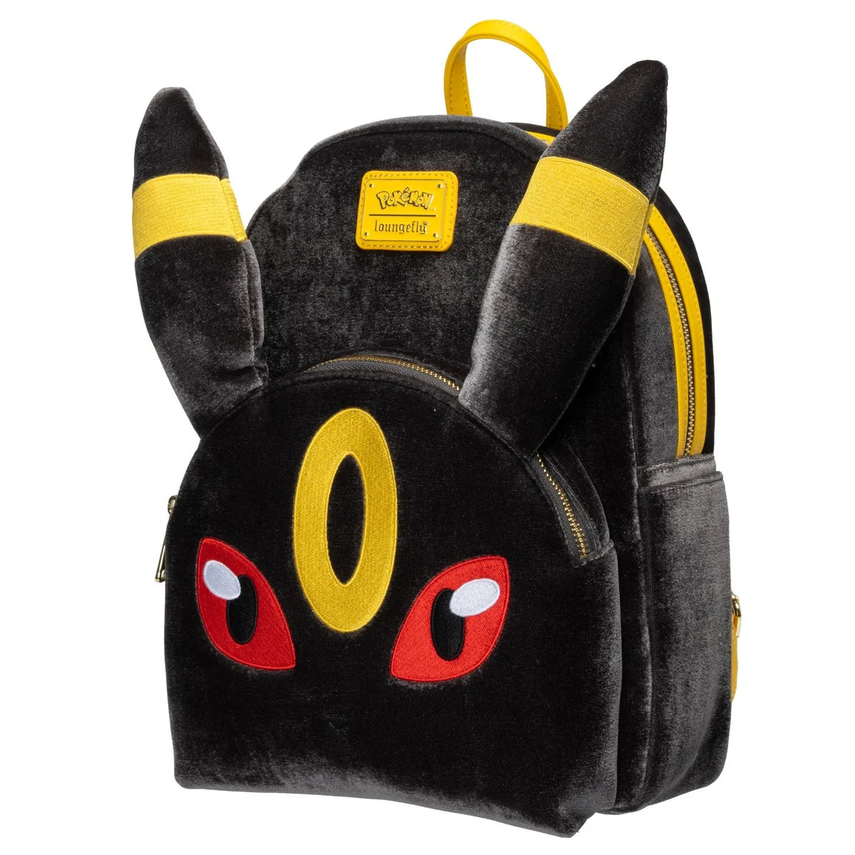A plush toy backpack designed to look like a black Pokémon character with yellow ear bands, a yellow forehead emblem, and red eyes, shown on a plain white background.