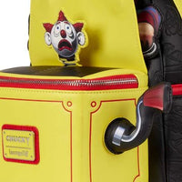 Yellow backpack with a clown patch and 'Chucky' label