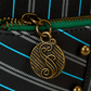 Loungefly Elphaba mini backpack styled as Shiz University uniform, complete with embroidered patches, buckles, and an eye-catching green finish perfect for cosplay or everyday use.
