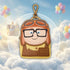Keychain with cartoon character in a cloud with balloons