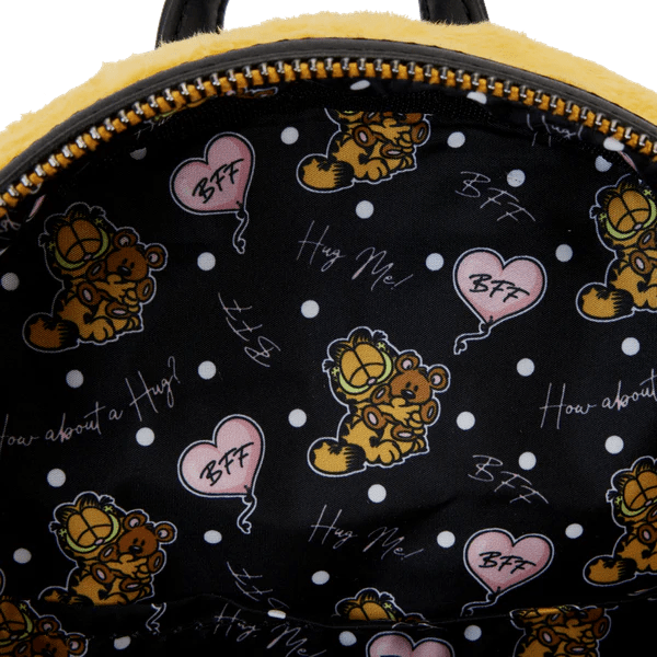 Backpack with Garfield cartoon characters and text on a black background with white polka dots.