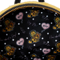 Backpack with Garfield cartoon characters and text on a black background with white polka dots.