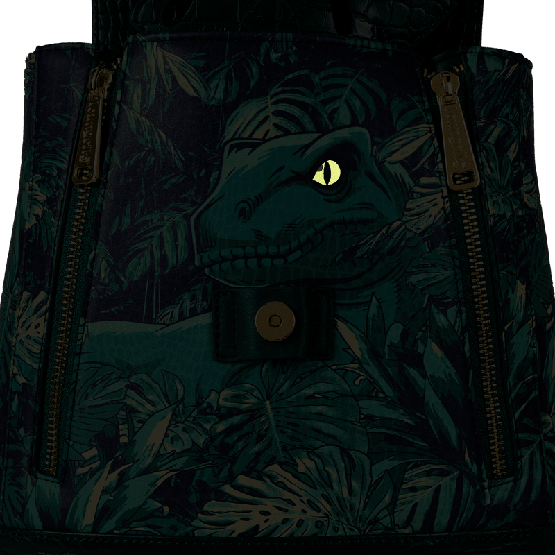 Loungefly mini backpack with glowing velociraptor design from Jurassic World

