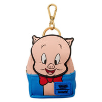 Cartoon pig character keychain with blue pants and red bow tie on a white background