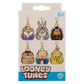 Packaging of Looney Tunes keychains with character illustrations on a beige background.