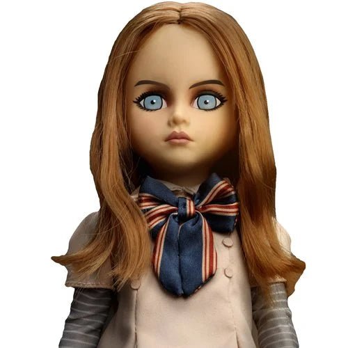 Close-up of a doll with long brown hair and a striped scarf on a white background