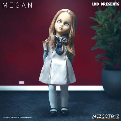 Mezco Toyz doll named Megan against a red wall with a plant on the right.