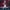 Doll named Megan in a white coat with a red background, Mezco Toyz brand visible