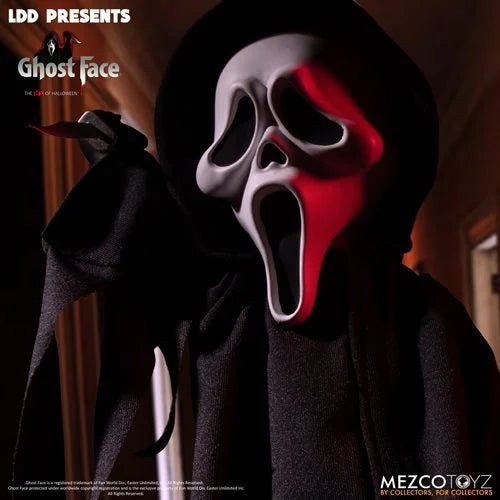 Person wearing a dark hooded outfit with a Ghost Face mask, featuring red and white colors, on a blurred background.