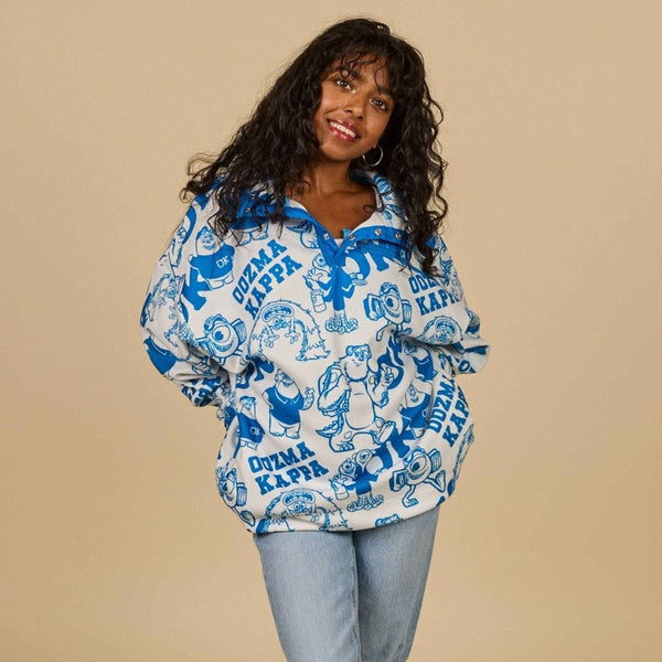 Person wearing a blue and white patterned jacket on a beige background