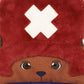 Close-up of a plush toy with a red hat and brown face