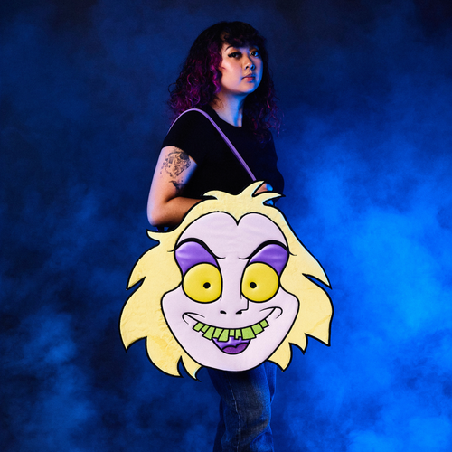 Person holding a large, Oversized Beetlejuice Tote Bag with a blue smoky background