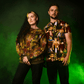 Two people wearing ParaNorman All Over Print T-Shirt against a green background
