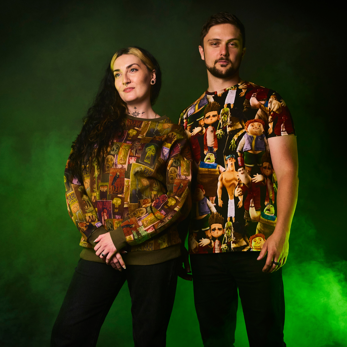 Two people wearing ParaNorman All Over Print T-Shirt against a green background