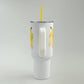 White tumbler with banana design on a gray background