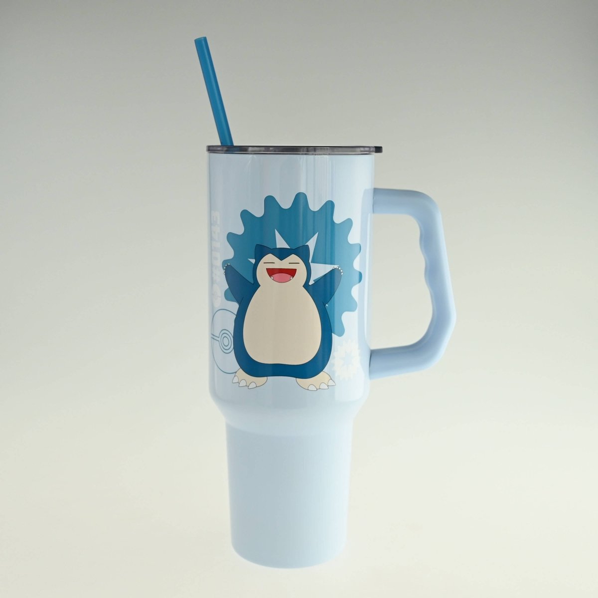 Light blue tumbler with a cartoon penguin design on a light gray background