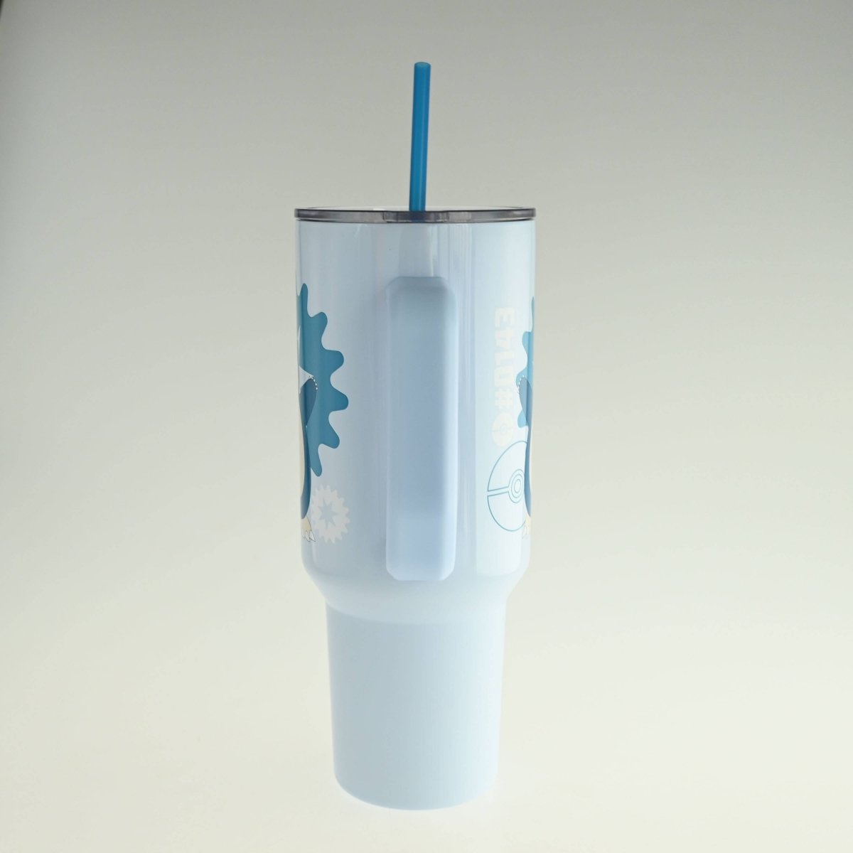 Light blue tumbler with a straw on a white background