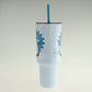 Light blue tumbler with a blue straw on a light gray background