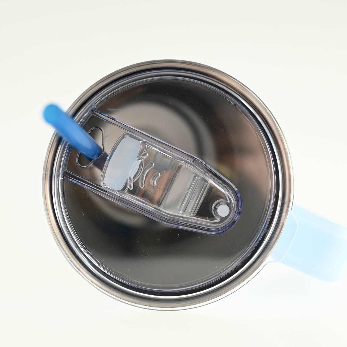 Close-up of a paint can with a roller inside on a white background