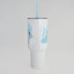 Clear tumbler with cartoon character design on a light gray background