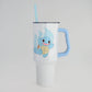 Clear tumbler with a cartoon character on a light gray background